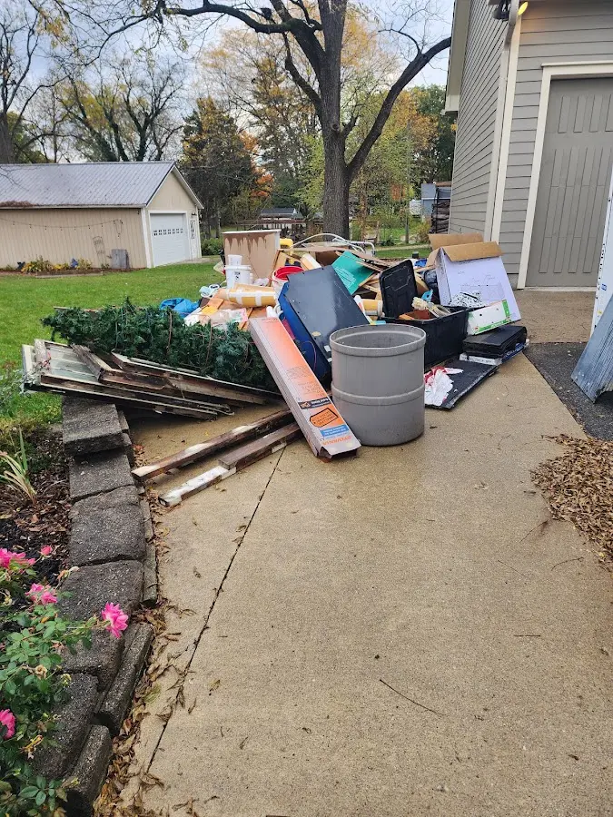 Dumpster being loaded with debris for Commercial Dumpster Rental in Ephrata